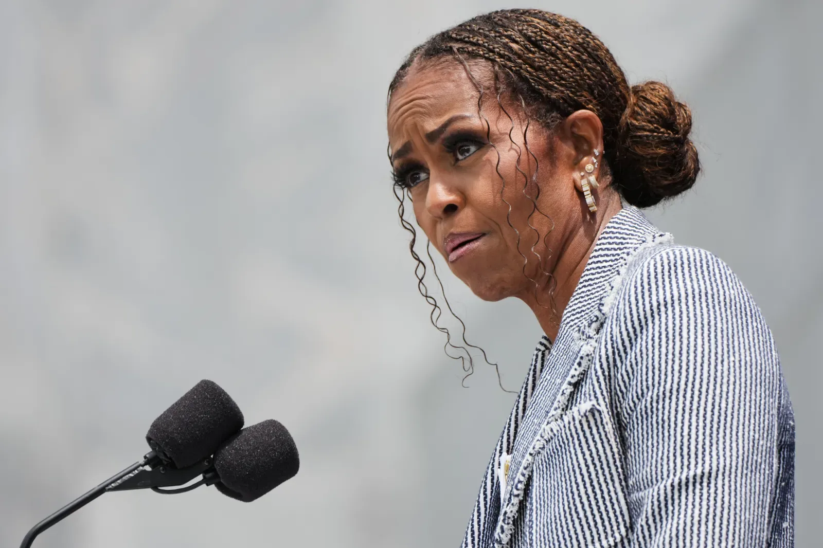 Michelle Obama praised Barack Obama's leadership, accomplishments, and legacy during the opening ceremony of the Obama Presidential Center in Chicago.