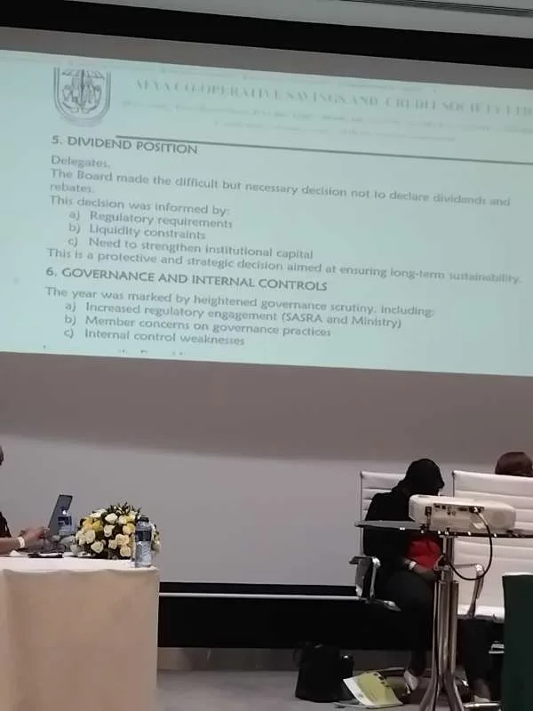 Afya SACCO delegates’ meeting presentation slide showing dividend position and governance notes, indicating no dividends or rebates were declared due to regulatory requirements, liquidity constraints, and the need to strengthen institutional capital, alongside references to heightened regulatory engagement and internal control weaknesses.